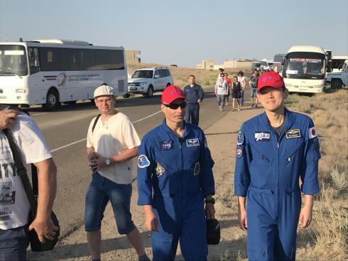 Cosmonaut Vande Hai and Norishigi going to look for roll-out of spaceship