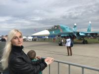 tourist near Sukhoi jet fighter