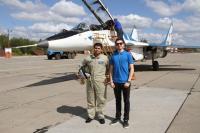 Indian tourist with our manager near MiG-29 before flight to Stratosphere